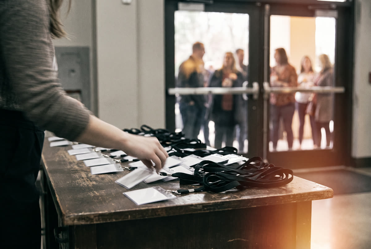 Name badges laid out on the registration desk before doors open