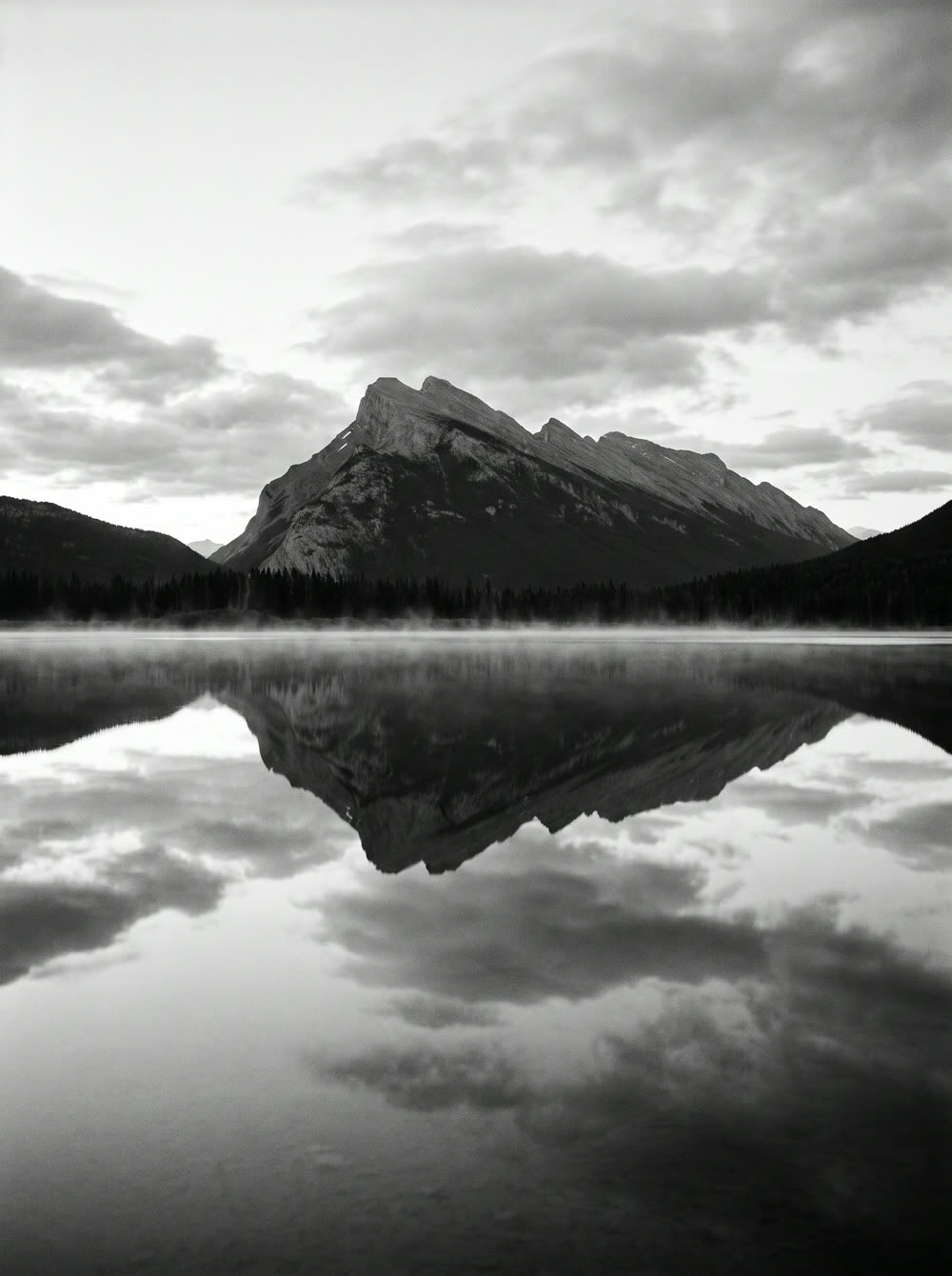 A mountain lake mirrored perfectly in still water