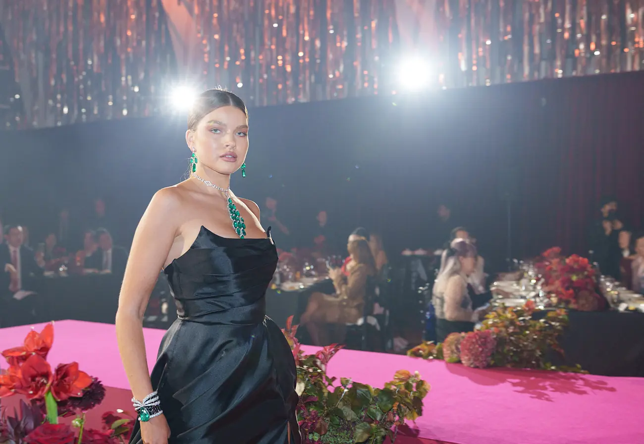 A guest at a gala dinner table