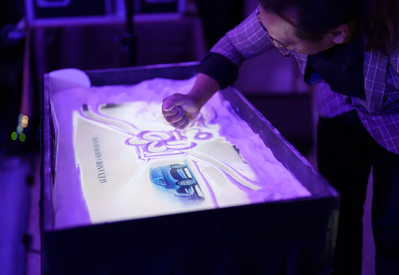 A vehicle revealed under the launch lighting