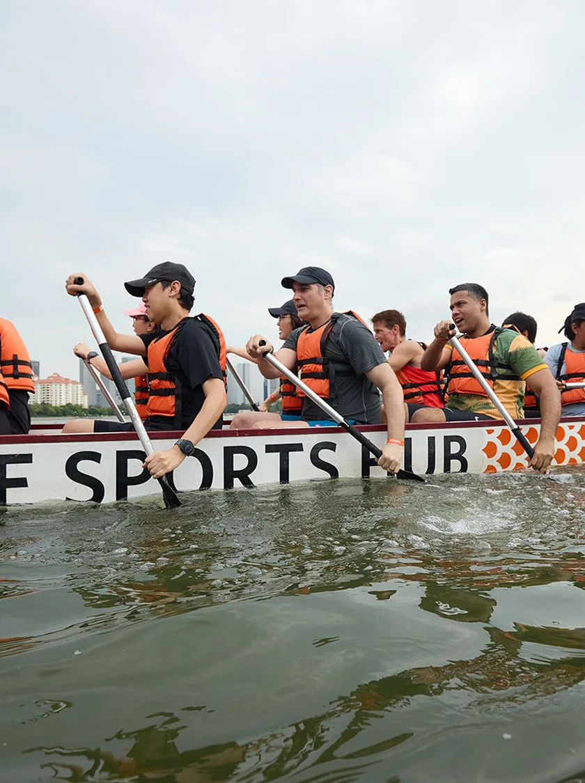 A dragon boat crew mid-race