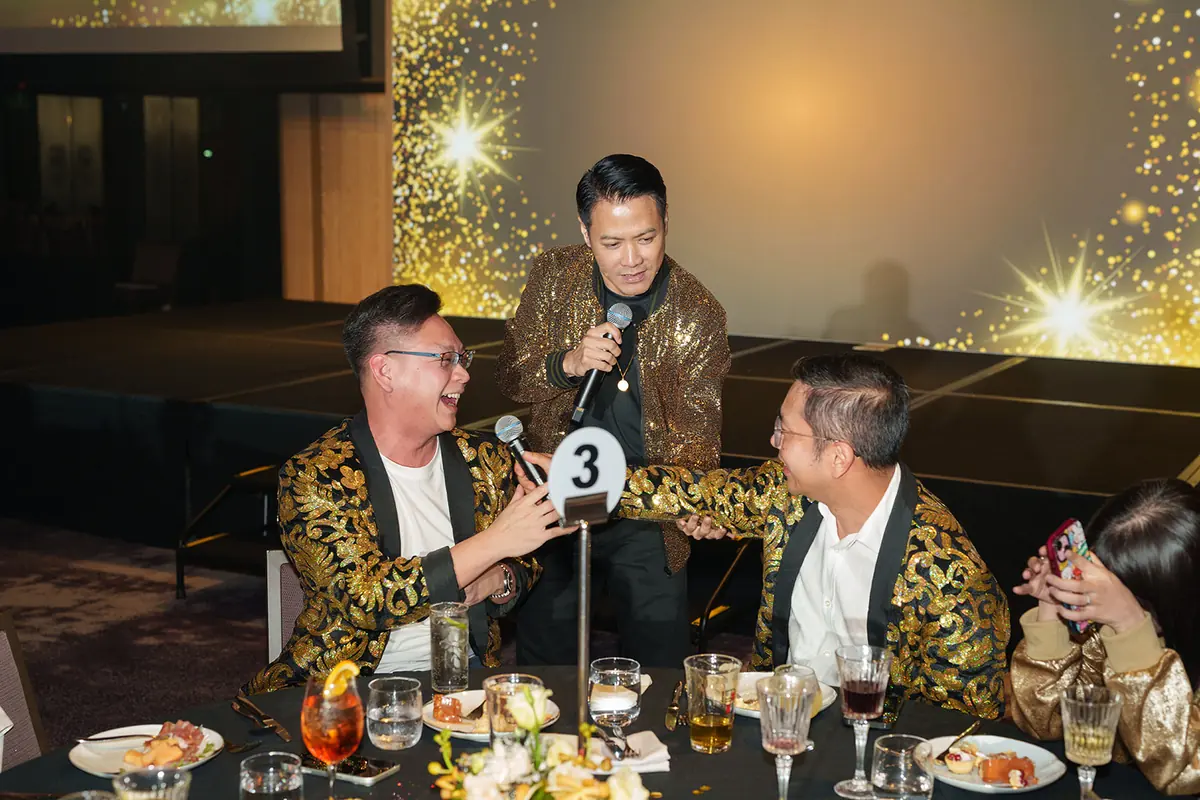 The emcee running a game at one of the tables